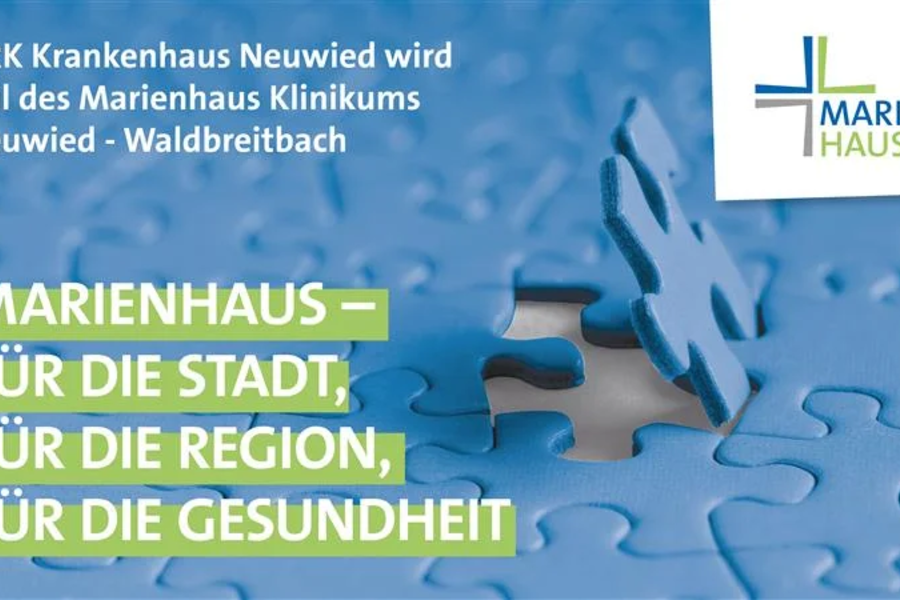 Ein blauer Puzzlestück wird in ein Puzzle eingesetzt. Text: 'MARIENHAUS – FÜR DIE STADT, FÜR DIE REGION, FÜR DIE GESUNDHEIT'.